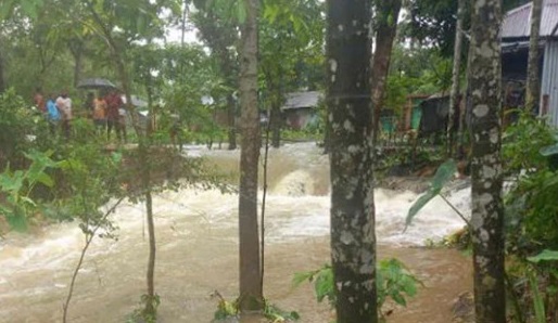 Water is entering the town after breaking the dam protecting the banks of Kushiara river