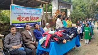 Distribution of winter clothes among school students in Srimangal